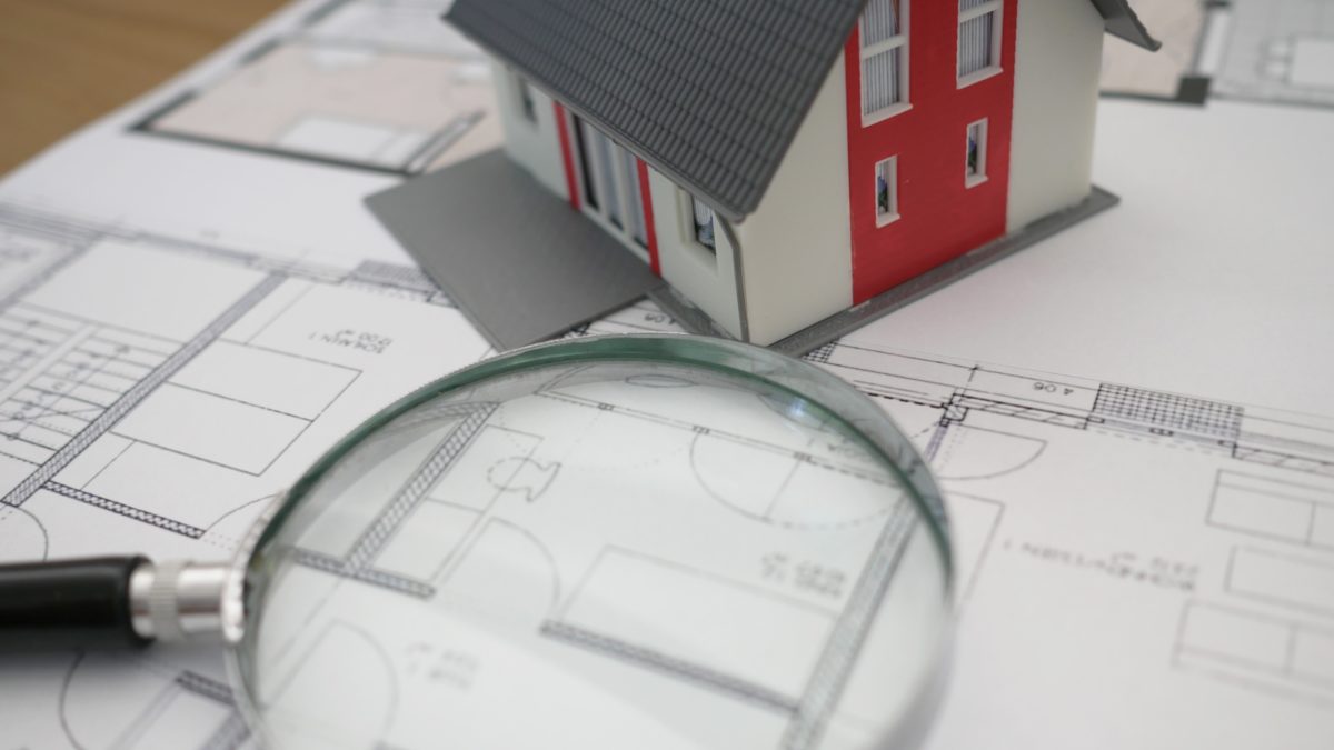 house-plans-and-a-magnifying-glass