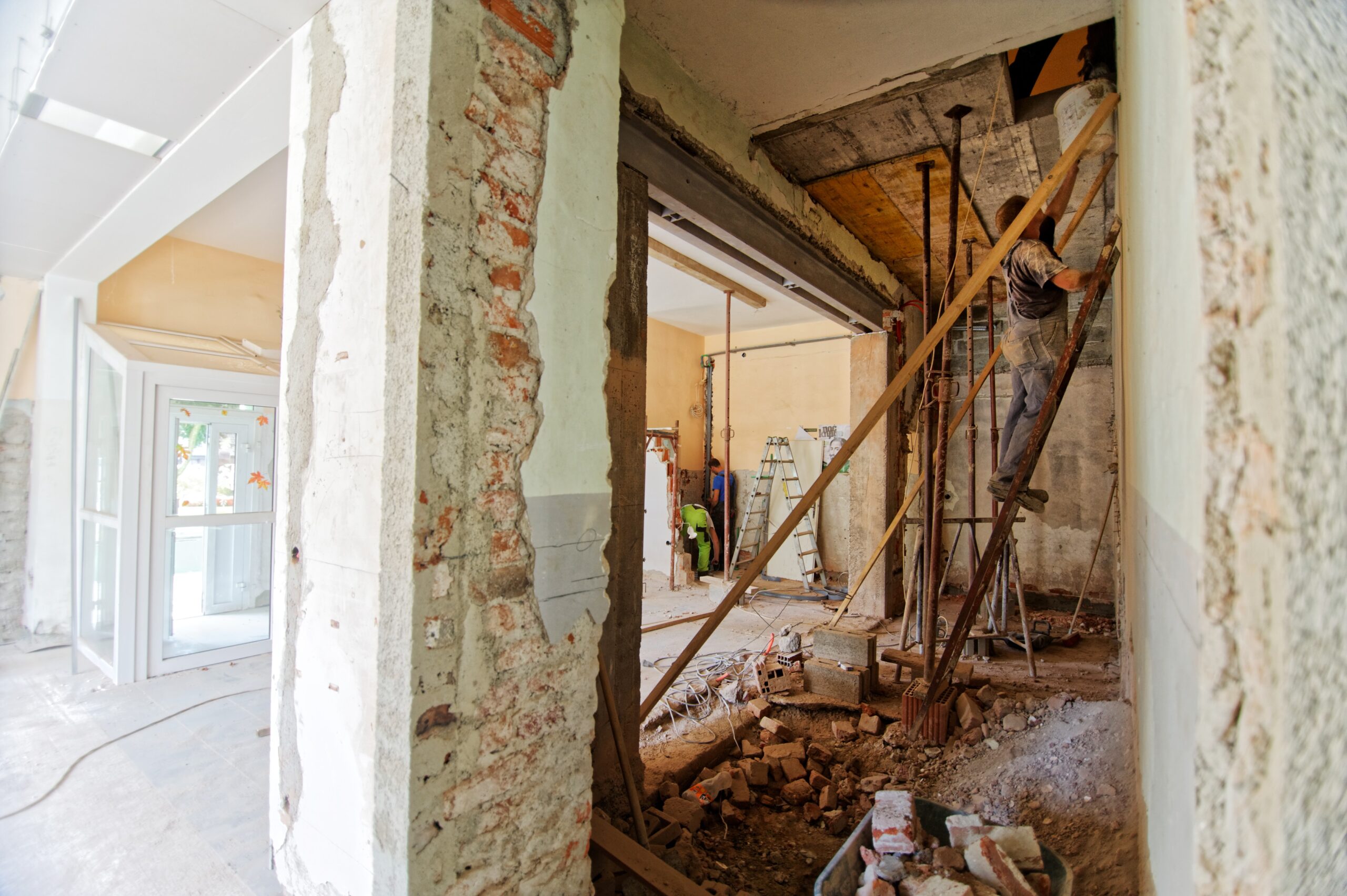 person-standing-on-a-ladder-doing-home-renovations