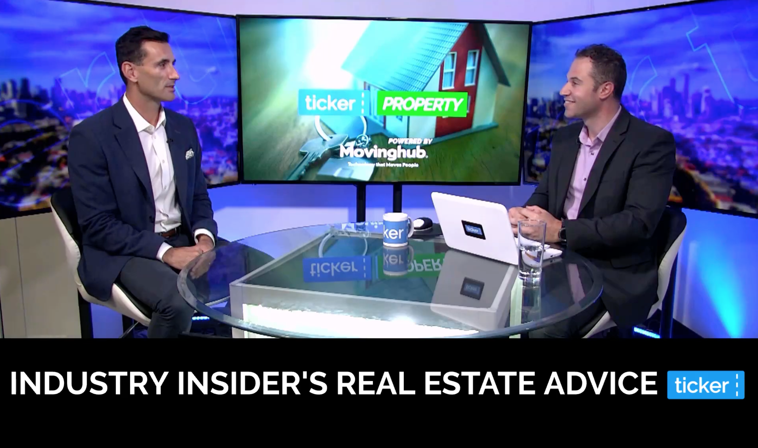 Two men sitting around a table discussing property investment advice