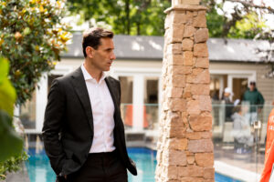 Andrew Date, Melbourne Buyer Agent listening intently at an auction