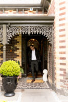 Buyer agent in Melbourne standing on an entryway house in Hawthorne