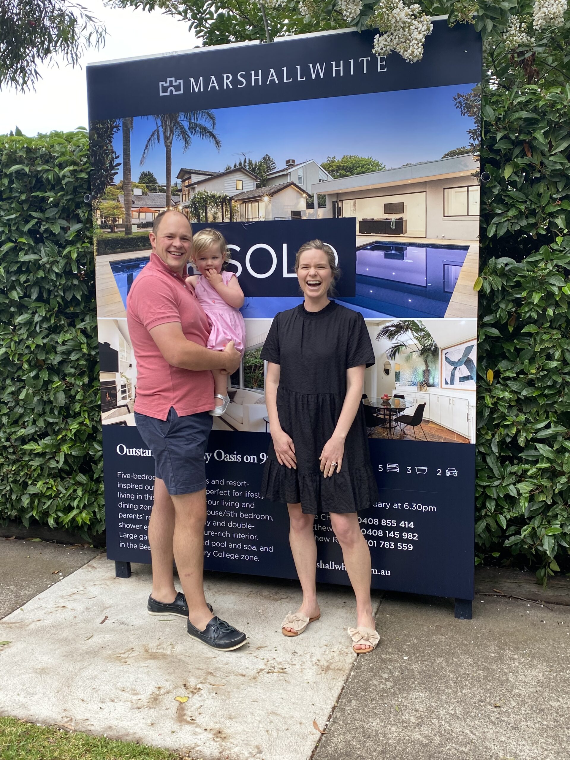 A family in front of their new house in Black Rock Melbourne